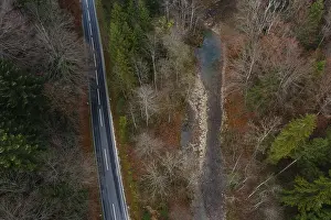Drone shot, Wangauer Ache with federal road and autumnal mixed forest from above