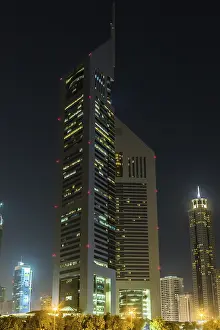 DUBAI - APRIL 18: Emirates Towers and Burj Khalifa at night time