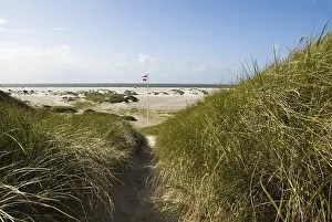 Dune landscape in front of a blue sky on the beach of Norddorf on the North Frisian island of Amrum