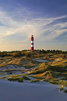 Dunes in the evening light with the lighthouse