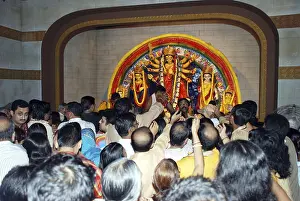 Durga clay model and devotes on Durga puja