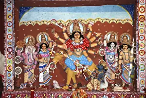 Category Historic EN Prints: Durga clay model killing demon with statues of kartikeya ganesha and lakshmi saraswati on Durga puja