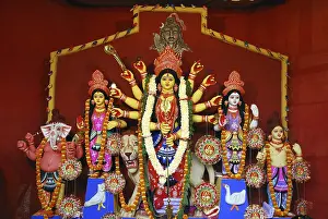Category Historic EN Prints: Durga clay model with statues of kartikeya ganesha and lakshmi saraswati on Durga puja
