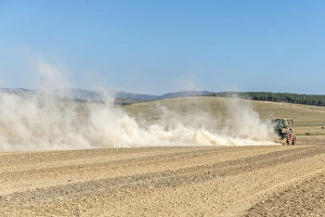 Category Mountain Landscapes Prints: Dust cloud lifted by tractor in times of drought