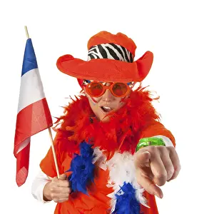 Dutch woman dressed in orange with Holland flag