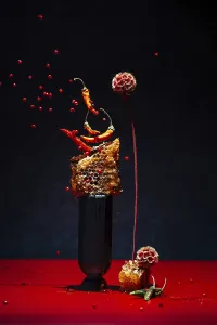 Dynamic display with chilies peppers and honeycomb on a black background