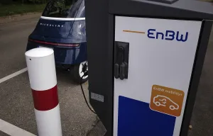 E-light vehicle, cabin scooter MICROLINO at charging station EnBW for electric cars