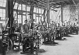 Early 20th century black and white archival photo showing workers