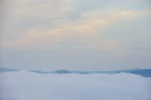 Early fog low-lying clouds in low mountain ranges