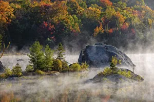 Early morning mist on lake in Autumn