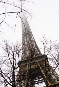 Eiffel Tower, its pinnacle disappearing into the fog