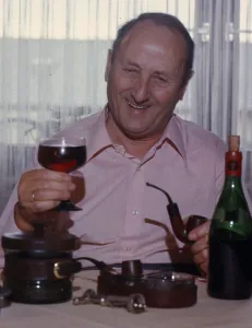 Elderly man drinking red wine