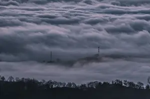 Electric poles between the mist of the mountains of the valley of Lesaka