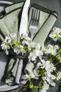 Elegant table setting with knife and fork on a green napkin