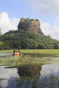 Elephant ride in lake by rock palace