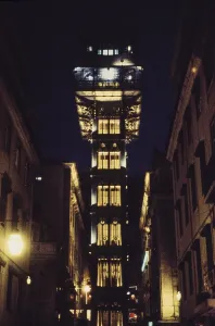Elevador de Santa Justa at night with illuminated steel architecture