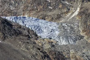 Embedded glacier between rocky brown mountains