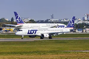 An Embraer 190 aircraft of LOT Polish Airlines with the registration number SP-LME at the airport in Warsaw