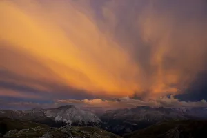 Engadine mountains with cloudy sky at sunset