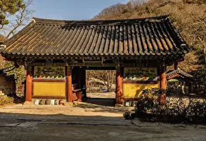 Entrance gate of Buddhist temple on sunny autumn morning