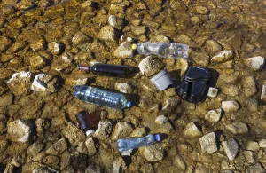 Environmental pollution, Household waste washed up on the lake shore