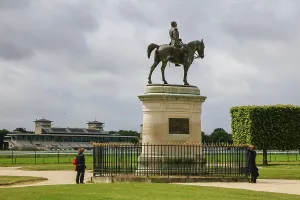 Equestrian statue of Henri d'Orleans in front of Les Grandes Ecuries from the 18th century