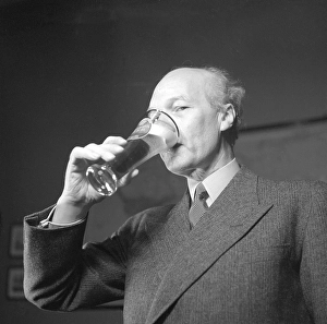 Erik Olson (1886-1966) Swedish industrialist. Head of the Pripp & Lyckholm brewery in Gothenburg. He is seen drinking out of a beer glass, the beer of his own companies production. 1943