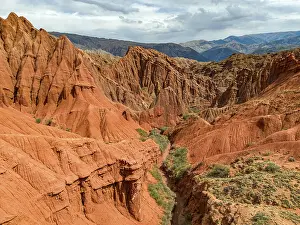 Eroded mountain landscape, canyon with red and orange rock formations
