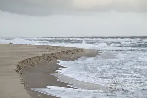 Erosion due to burning waves, sandy shore