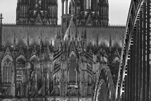 Evening atmosphere, Cologne Cathedral illuminated with LED lamps and the Hohenzollern Bridge