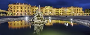 Evening atmosphere, Schoenbrunn Palace with reflection in the fountain