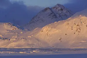 Evening light on snowy mountains