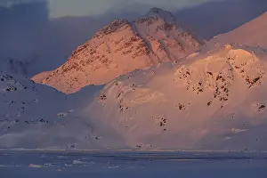 Evening light on snowy mountains