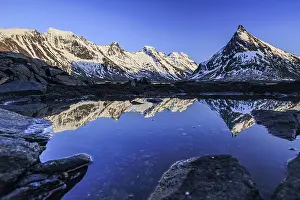 Evening light over steep mountains