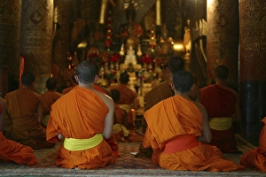 Evening prayer of the monks at temple Vat Xieng Thong in Luang Prabang