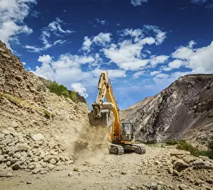 Excavator doing road construction in Himalayas