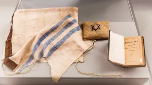 Exhibited objects in a display case from concentration camp prisoners