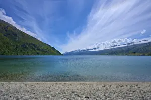 Expansive lake landscape under dramatic skies