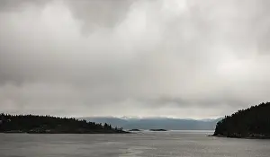 Framed Print : Expansive water view with cloudy skies and faint mountain outline in Nanaimo Framed Print : Expansive water view with cloudy skies and faint mountain outline in Nanaimo