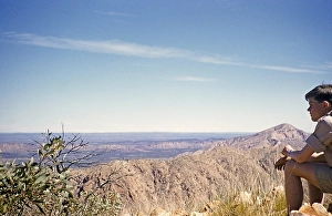 Expedition of the Melbourne Grammar School, Northern Territory, Australia 1956 a boy looks at the outback landscape of the West MacDonnell National Park near Alice Springs