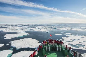 Expedition ship navigating through the pack ice in the Arctic