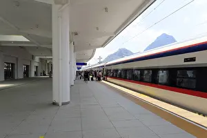 Category Historic EN Prints: Express train of the Laos-China Railway LCR at the platform of the modern railway station of Luang Prabang