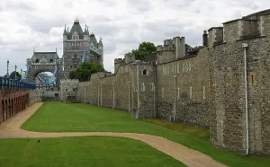 Extended view of stone fortress with green lawn