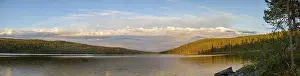 Extensive panorama of Gutulsjon lakeside under bright skies