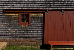 The exterior of an old barn and door