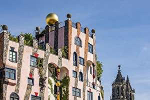 Facade of the architectural work of art Green Citadel and Magdeburg Cathedral