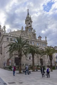 Facade of the old catholic church Real Parroquia de los Santos Juanes Valencia in the street Pl