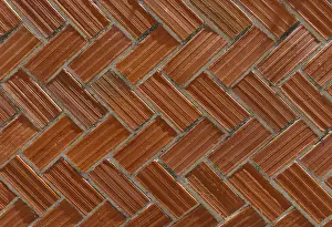 Face brick wall with a classic herringbone pattern