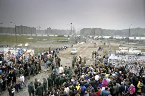 Fall of the Berlin Wall: cars and pedestrians are crossing the temporary border crossing at Potsdam Square