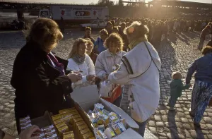 Fall of the Berlin Wall, at the Invalidenstrasse border crossing people from East Berlin are being given food parcels